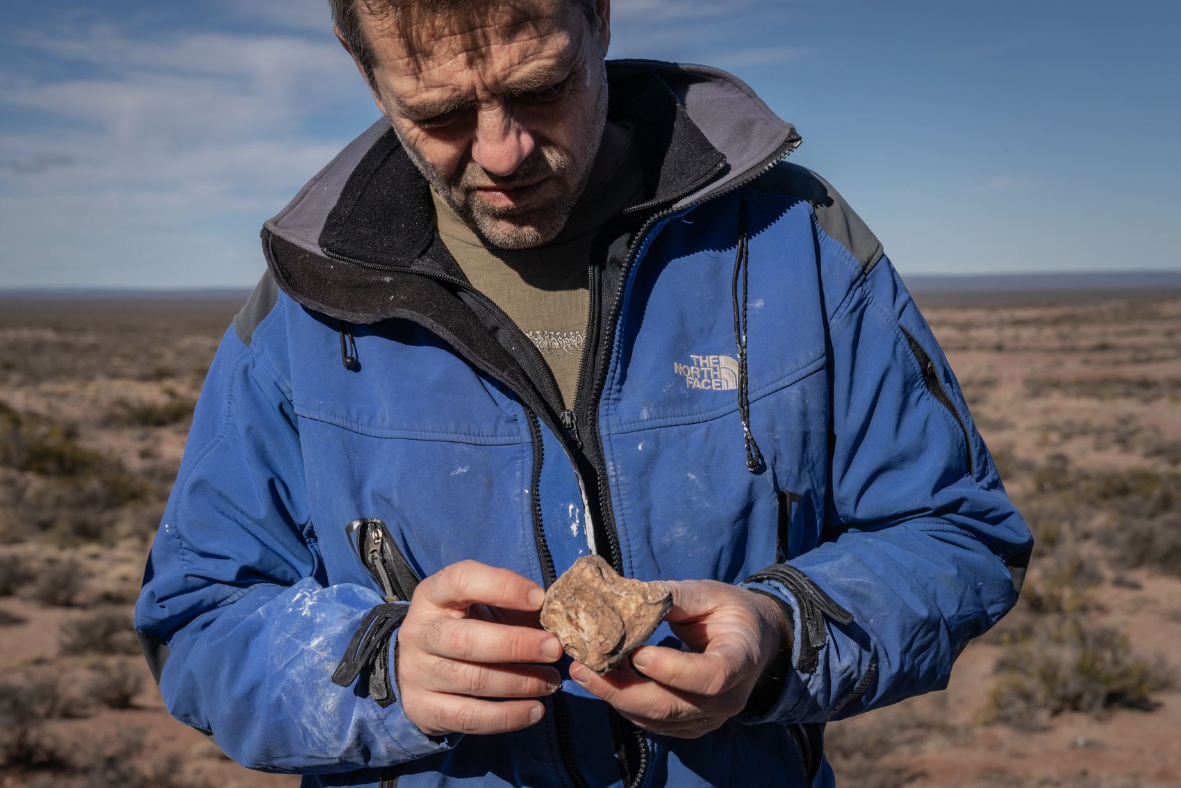 Diego Pol the paleontologist holding a fossil in Patagonia