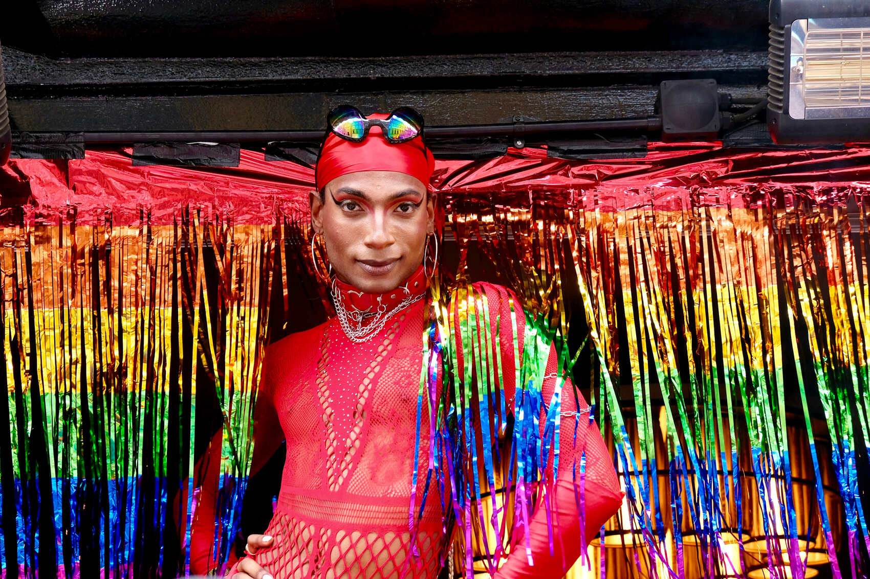 Someone dressed for Pride in a colourful outfit in Soho, London
