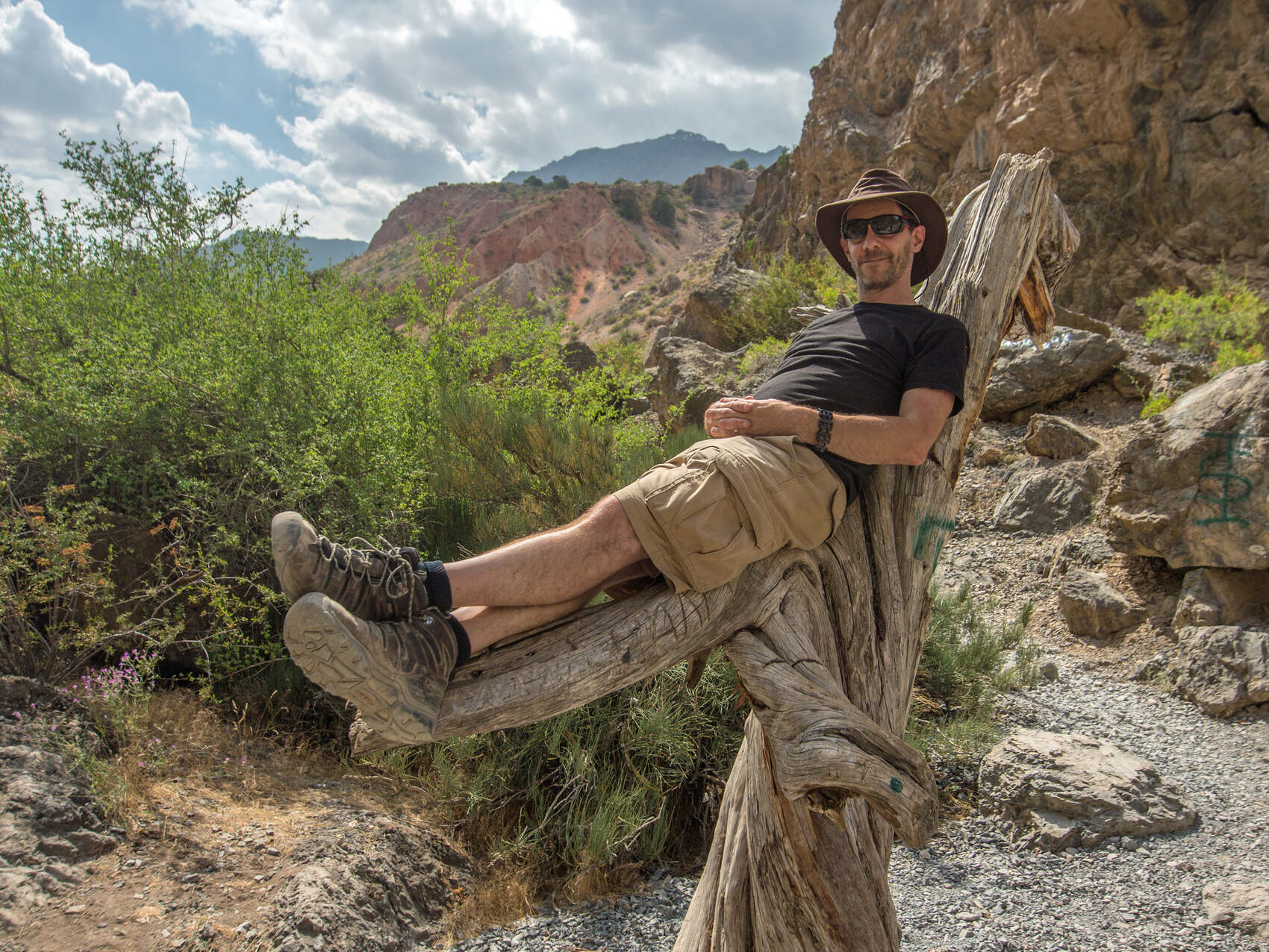 George Kourounis from National Geographic posing for a photograph lying down in Kyrgyzstan