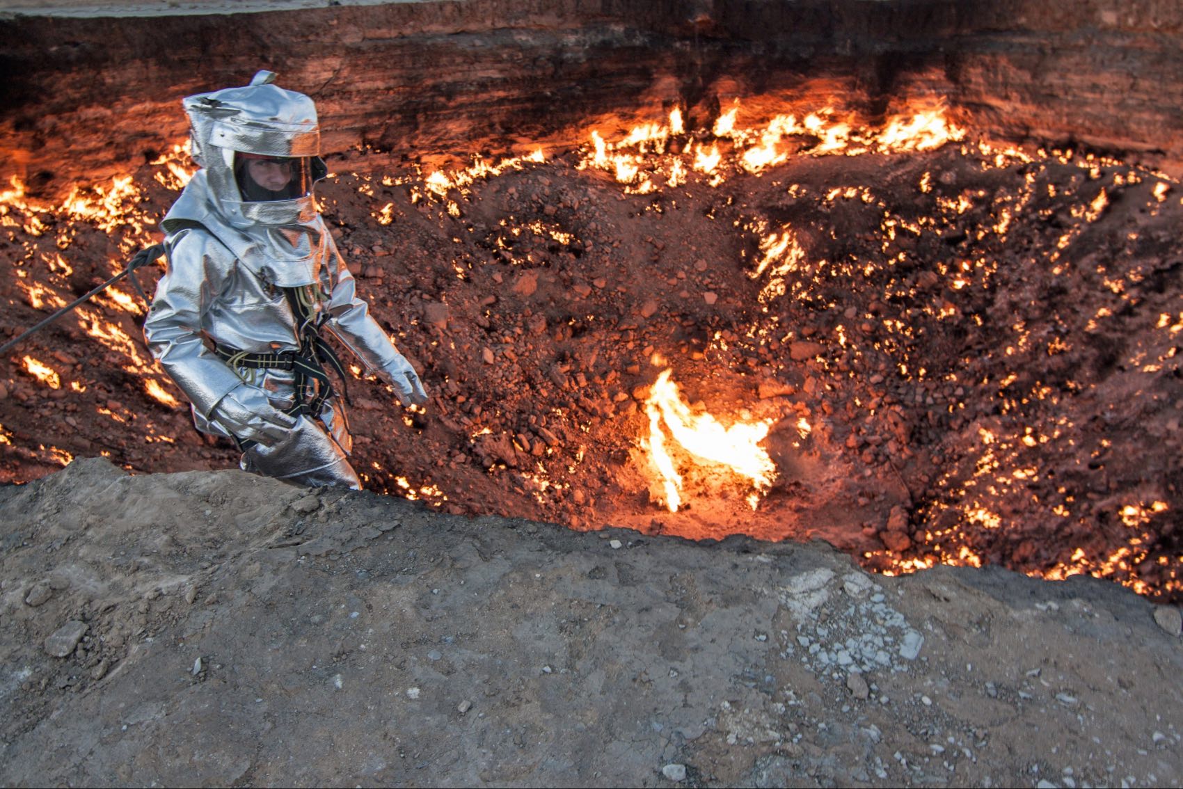 George Kourounis from National Geographic standing over the fiery Darvaza Gas Crater in Turkmenistan