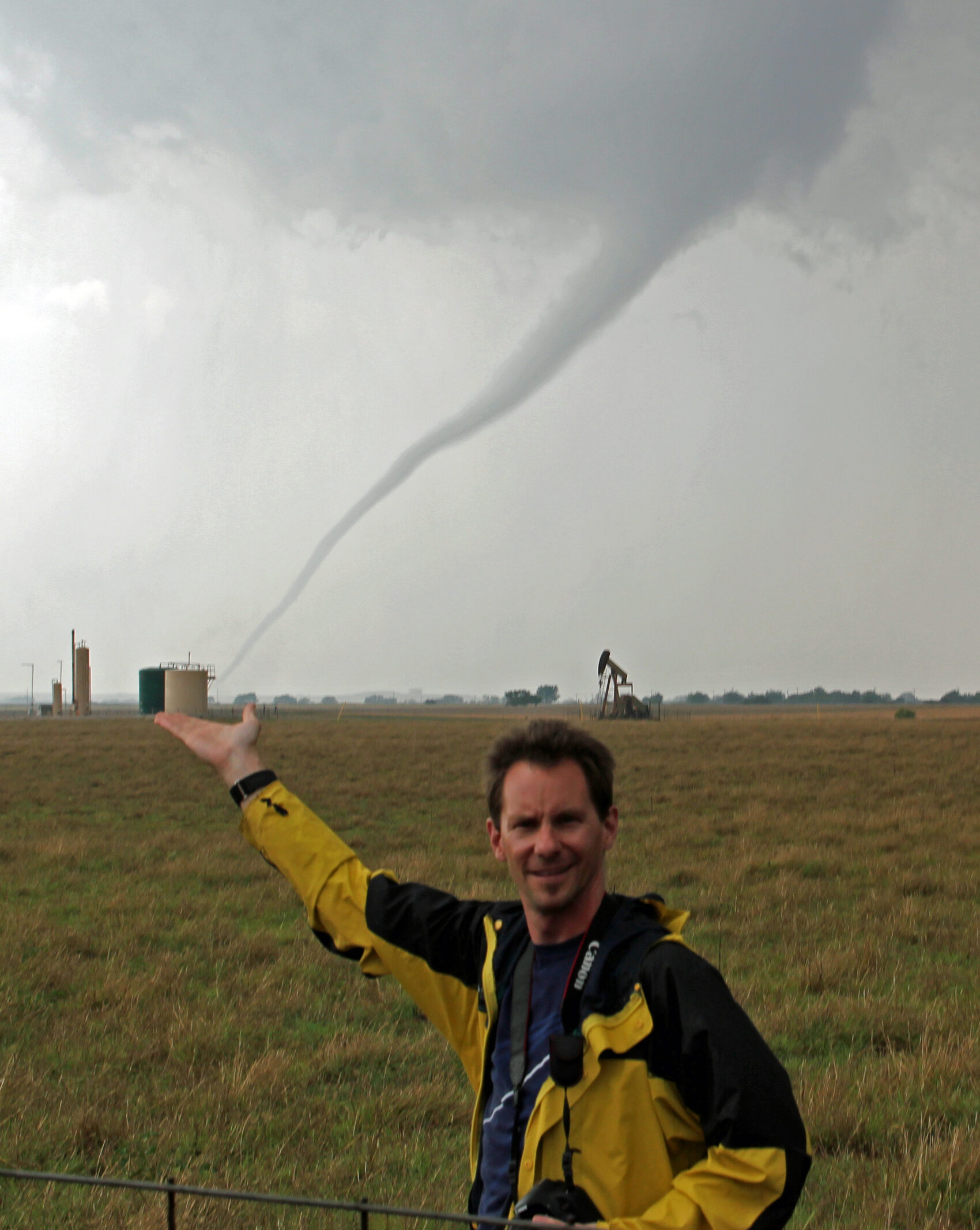George Kourounis from National Geographic standing in front of a tornado in Tornado Alley