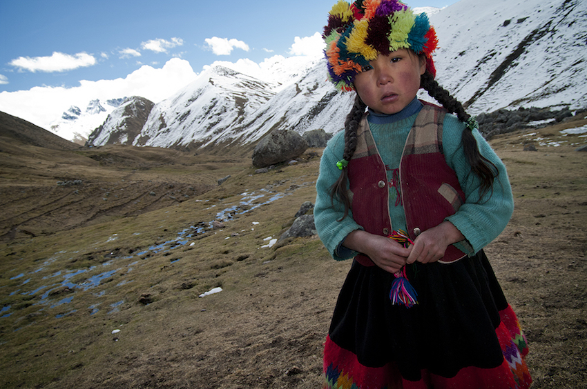quechuan girl staring into the camera.