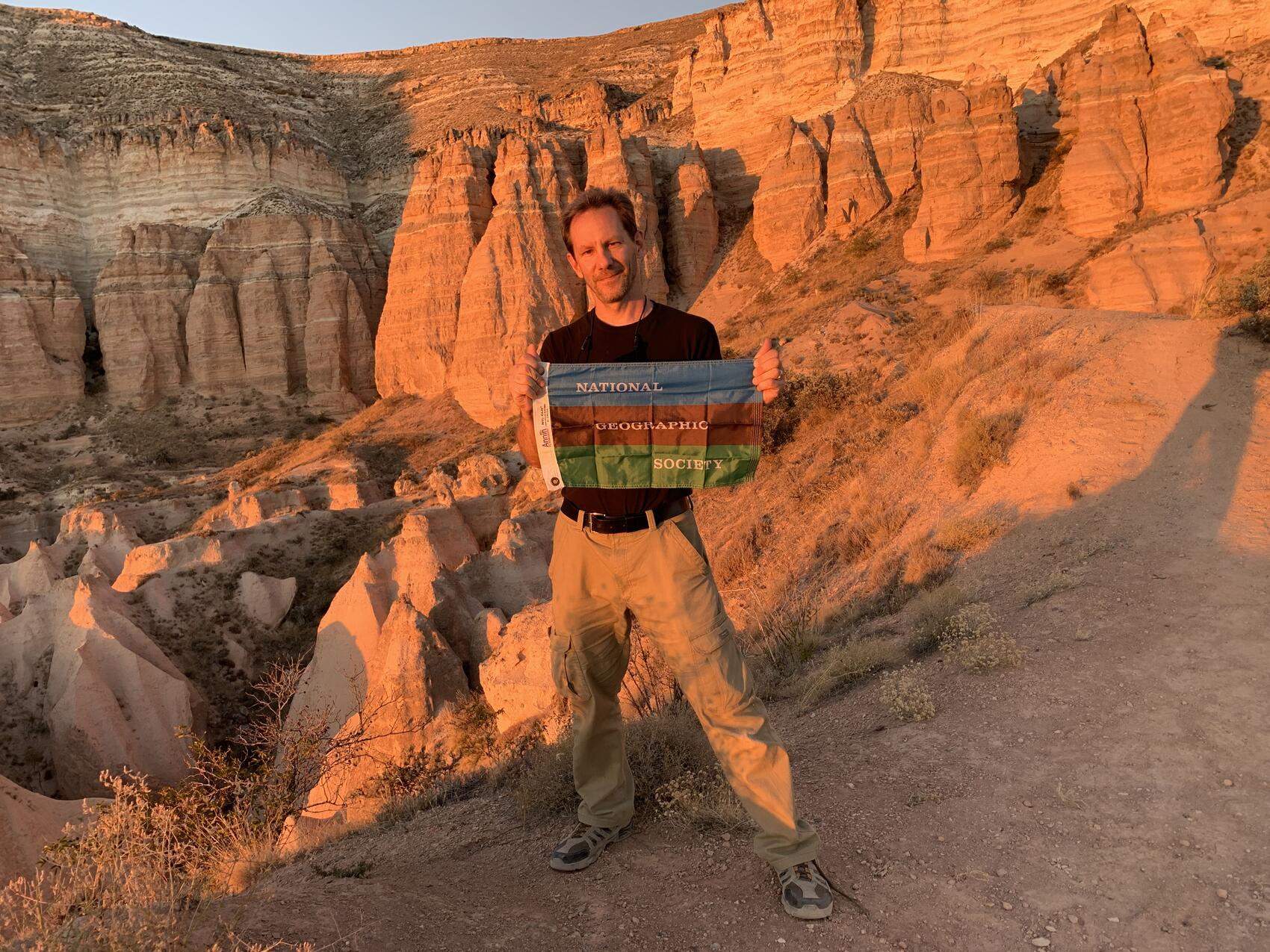 George Kourounis from National Geographic standing over a canyon in Cetral Asia