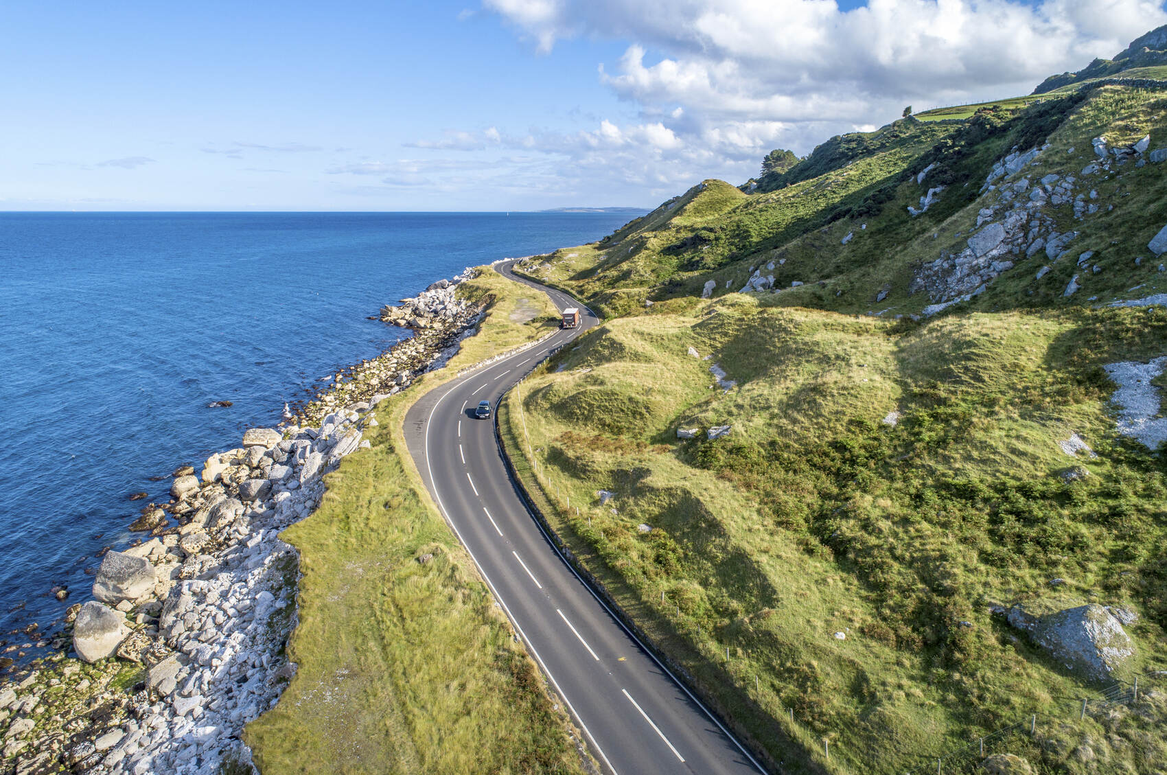 A car driving down the Wild Atlantic Way in Ireland — Krzysztof Nahlik