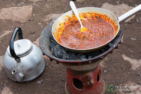 <p><em>Misir wat</em> cooked the traditional way over a charcoal stove.</p> Misir wat cooked the traditional way over a charcoal stove.