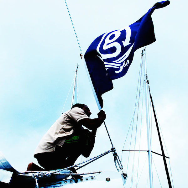 Raising the G Nation flag on the sail boat