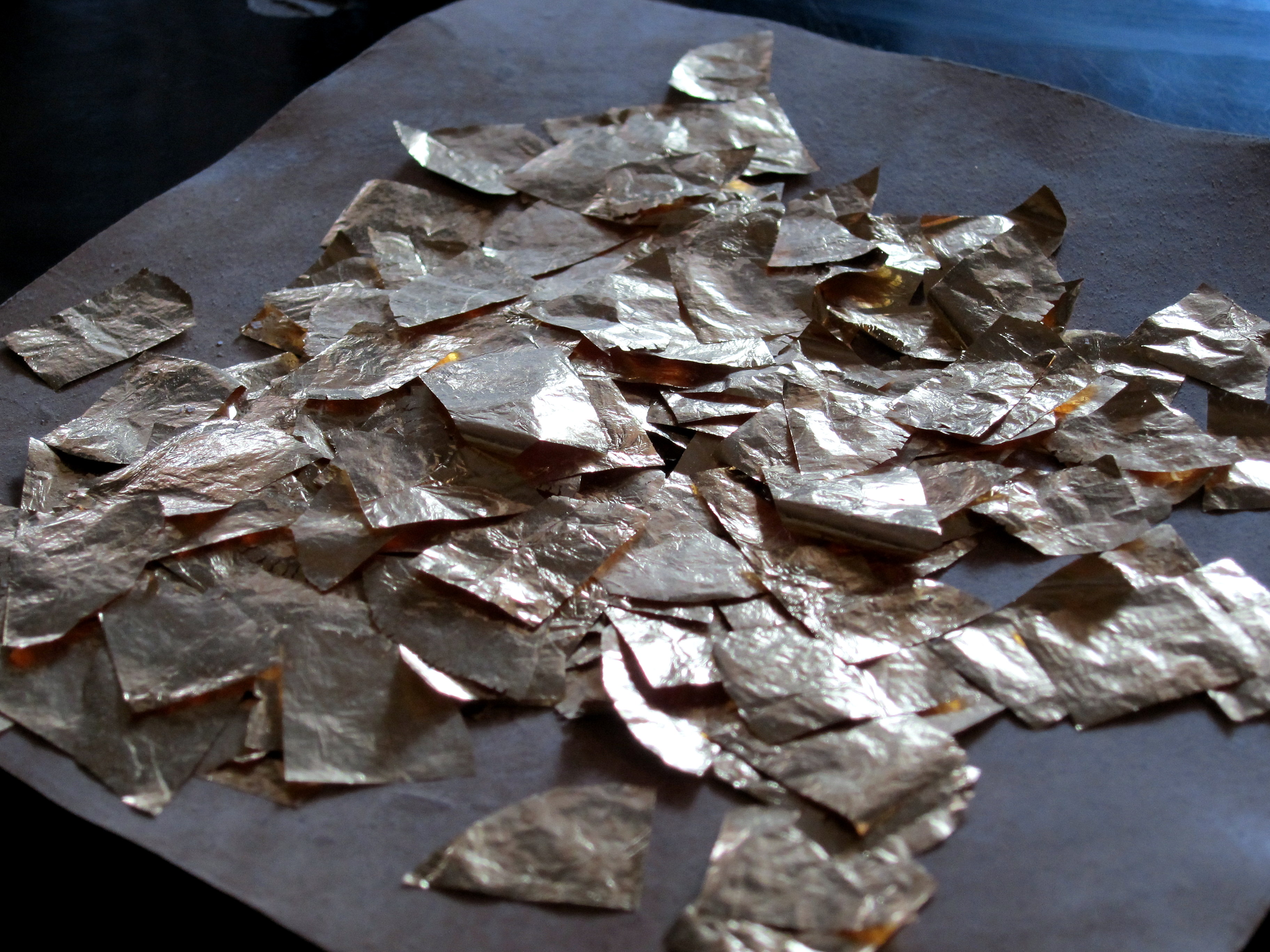 <p>Gold flakes from one of Mandalay's many gold vendors.</p> Gold flakes from one of Mandalay's many gold vendors.