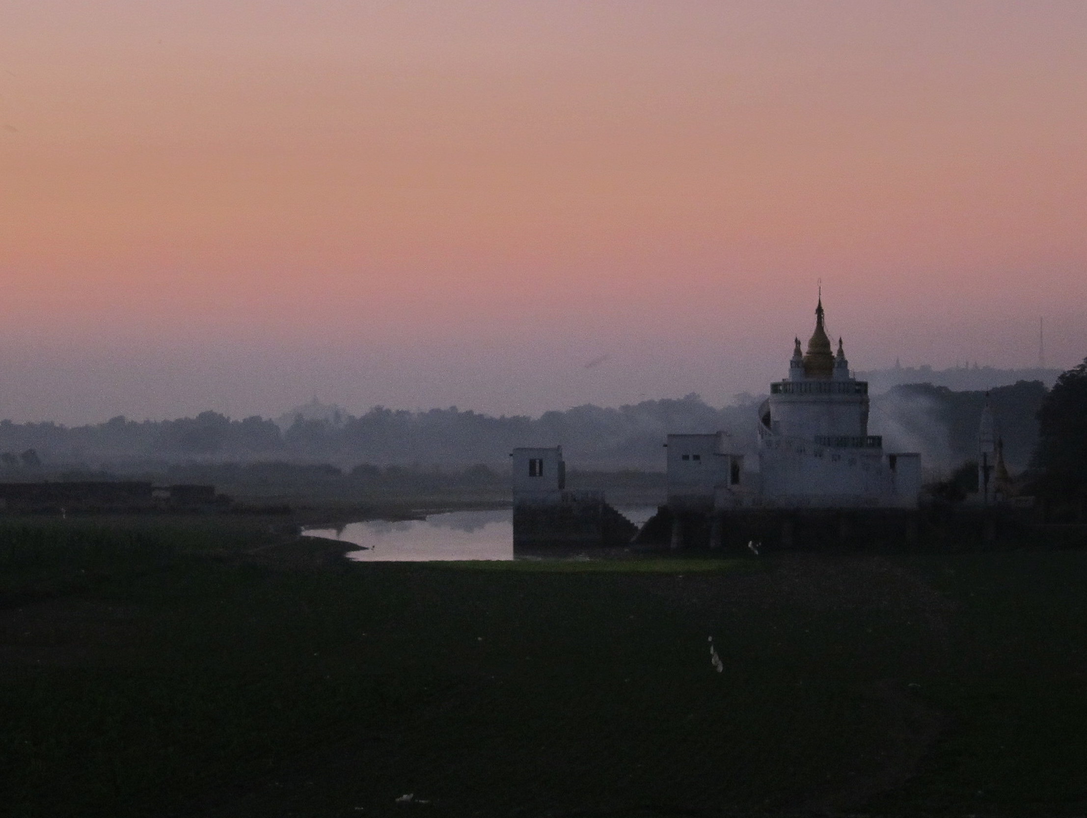 <p>Dusk on the ride back from U Bein Bridge to downtown Mandalay.</p> Dusk on the ride back from U Bein Bridge to downtown Mandalay.