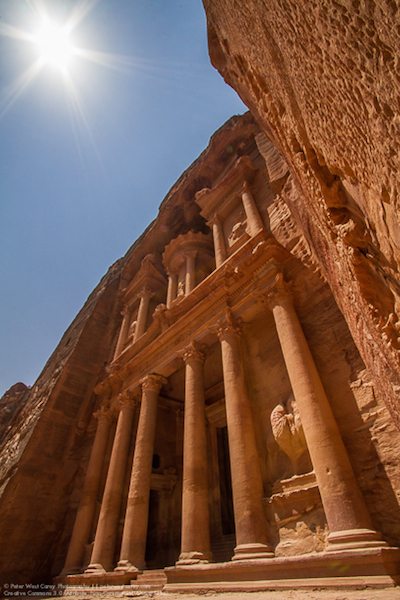 starbursting sun over petra in jordan