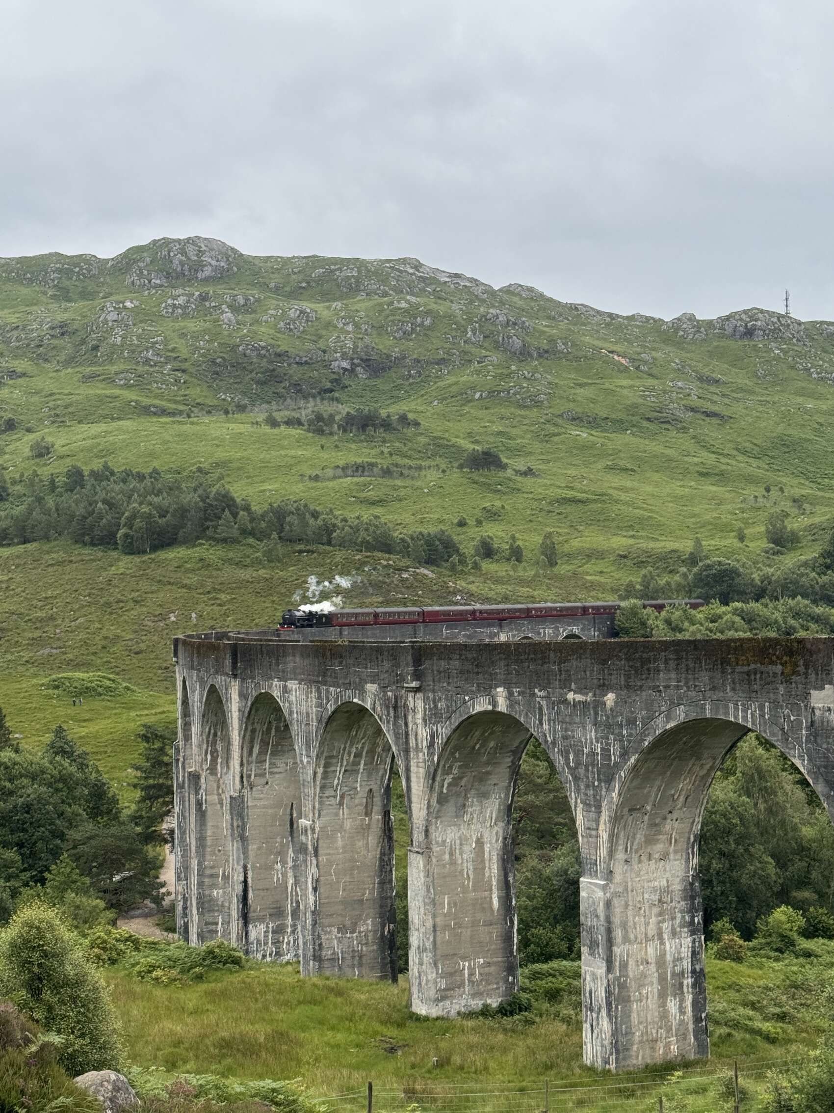 The famous Hogwart’s Express crossing the Glennfinnan Viaduct in Scotland
