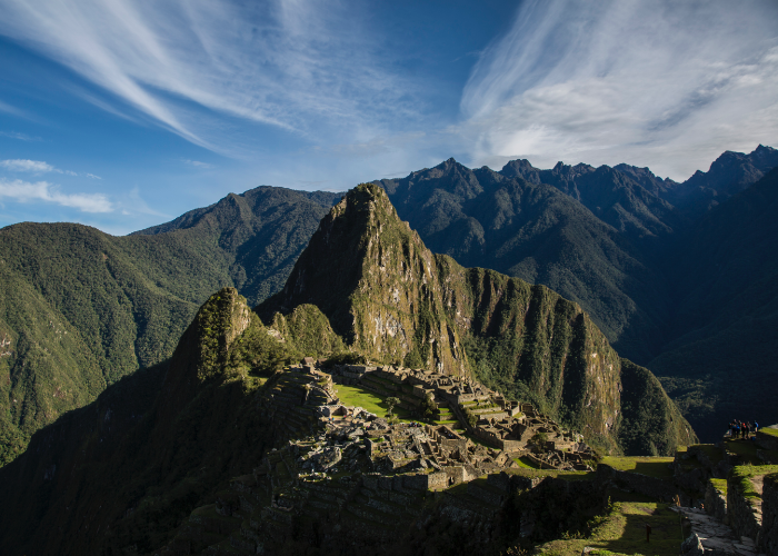 with a view of the famous citadel and the Machu Picchu mountain while the clouds float quietly in the blue sky