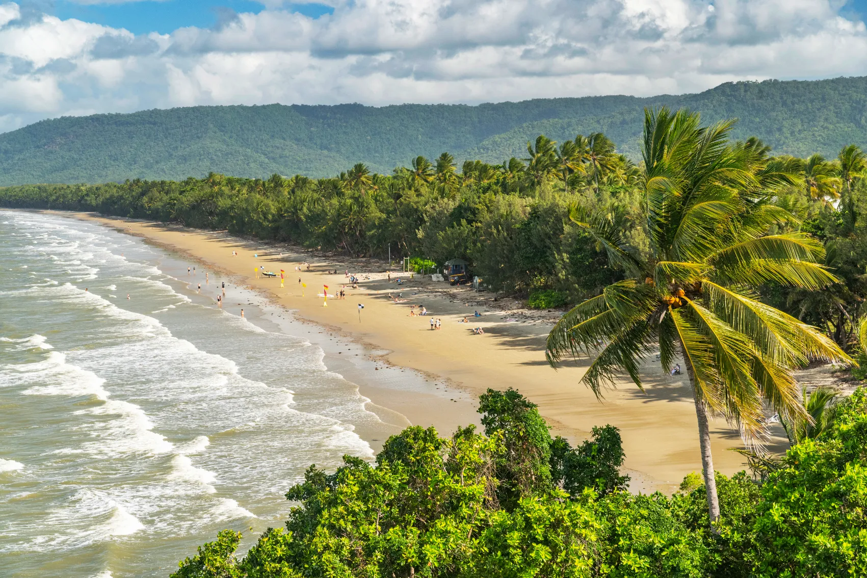 Elevated view of people relaxing on Four Mile Beach in Port Douglas, Australia