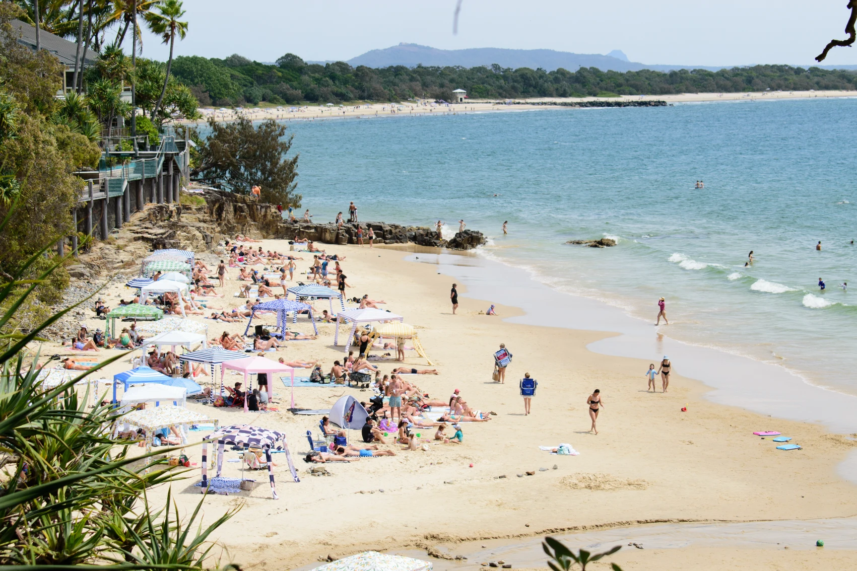 People relax on Sunshine Beach in Australia