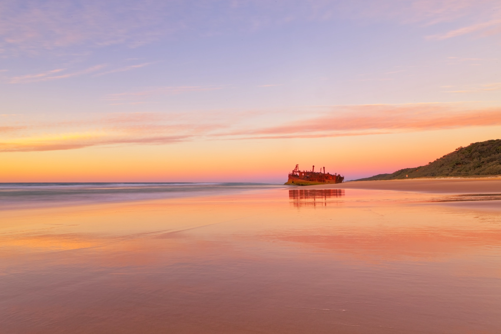 The Maheno shipwreck at sunrise in K'gari
