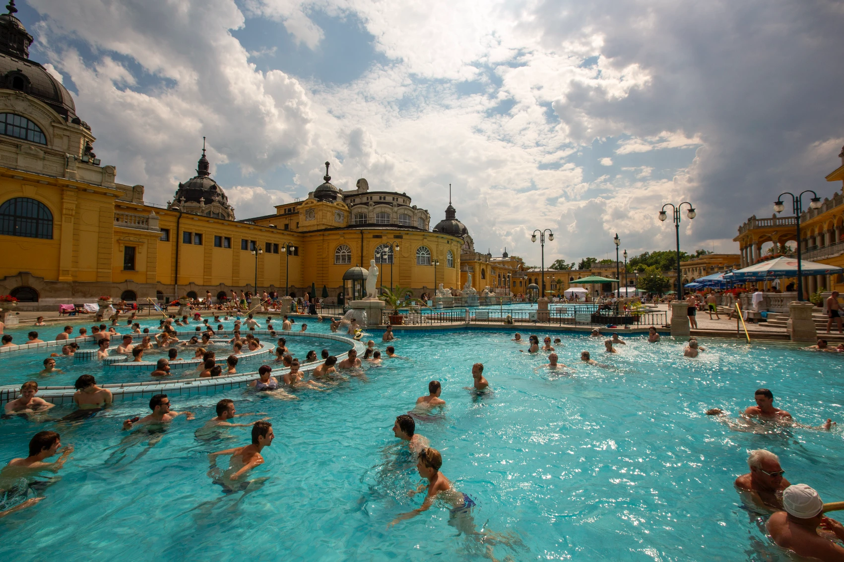 Swimmers hang out in the outdoor pools at the Széchenyi Thermal Bath in Budapest