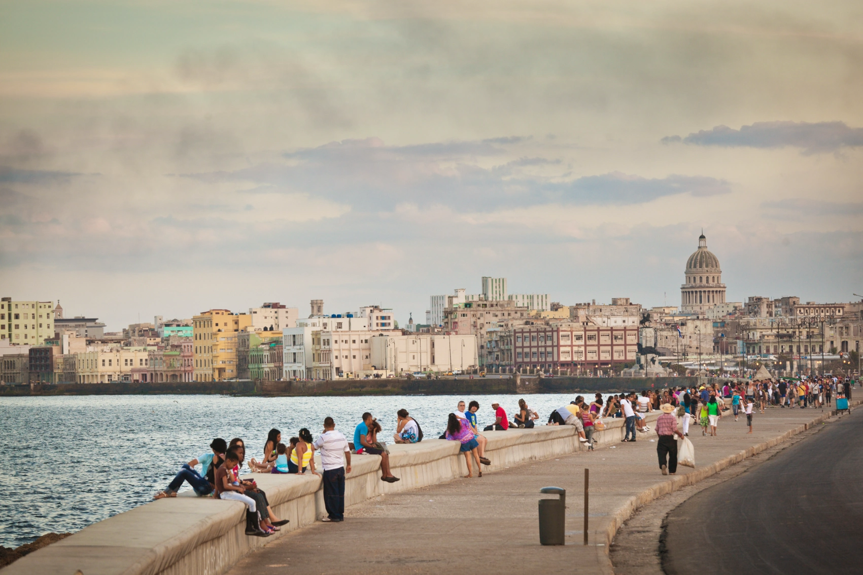 People hang out on the Malecón seawall in Havana