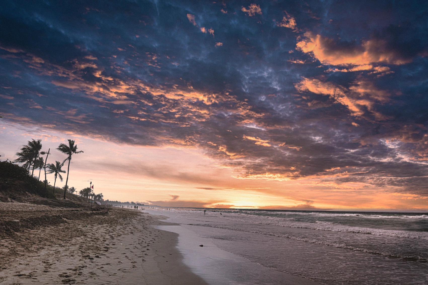A person walks along the Playas del Este beach near Havana, Cuba