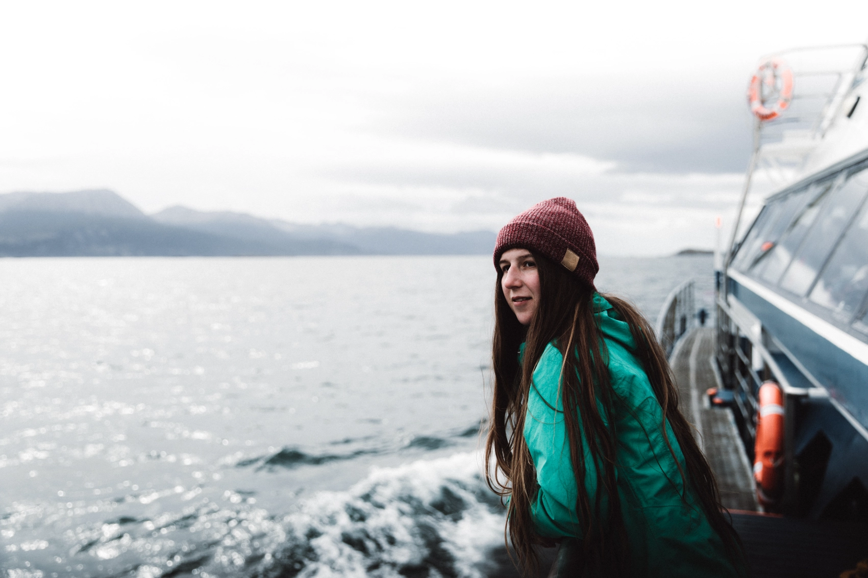 A woman looks at the landscape from a boat in the Beagle Channel in Ushuaia, Argentina