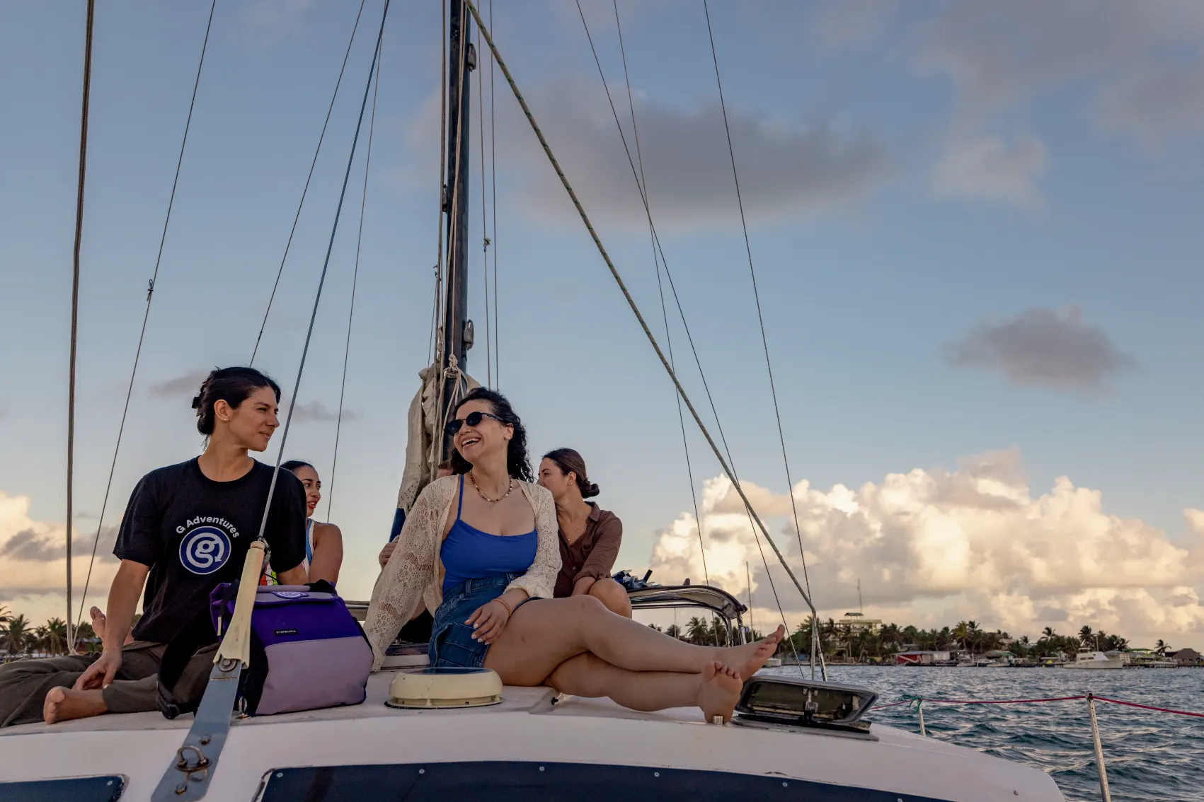 Belize Sailboat Travellers A bunch of young travellers sit alongside their CEO on a sailboat set for Hopkins, Belize