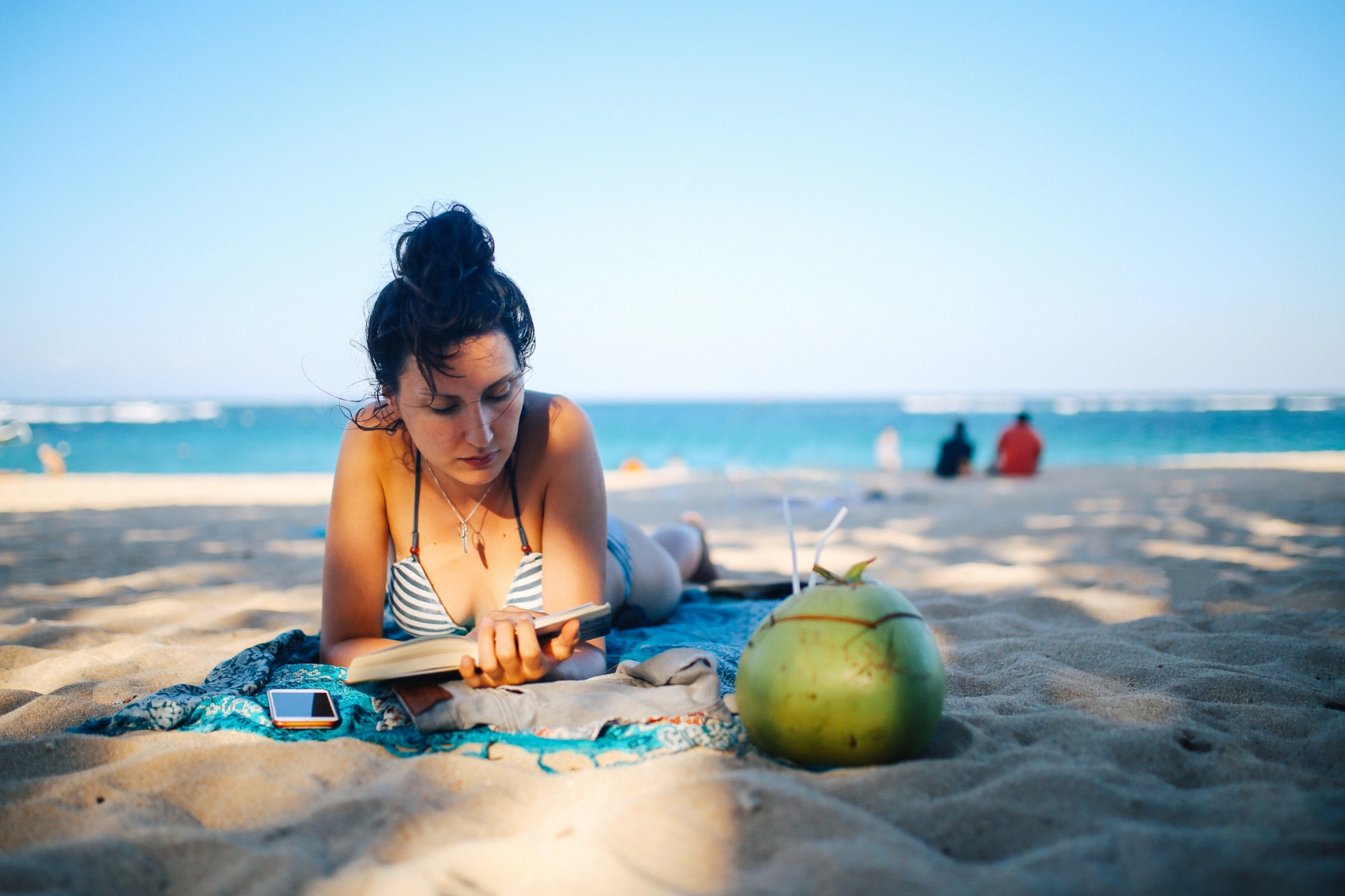 Nusa Dua, Bali A woman reads a book on Nusa Dua Beach, Bali