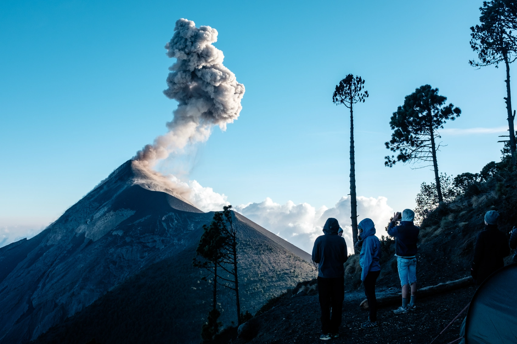 Acatenango Volcano hike, Guatemala Hikers watch steam and smoke rising from Acatenango Volcano in Guatemala