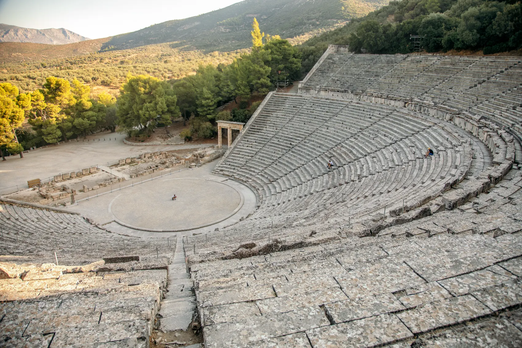 Theatre of Epidaurus, Greece View from the top of Theatre of Epidaurus with a forested countryside in the background