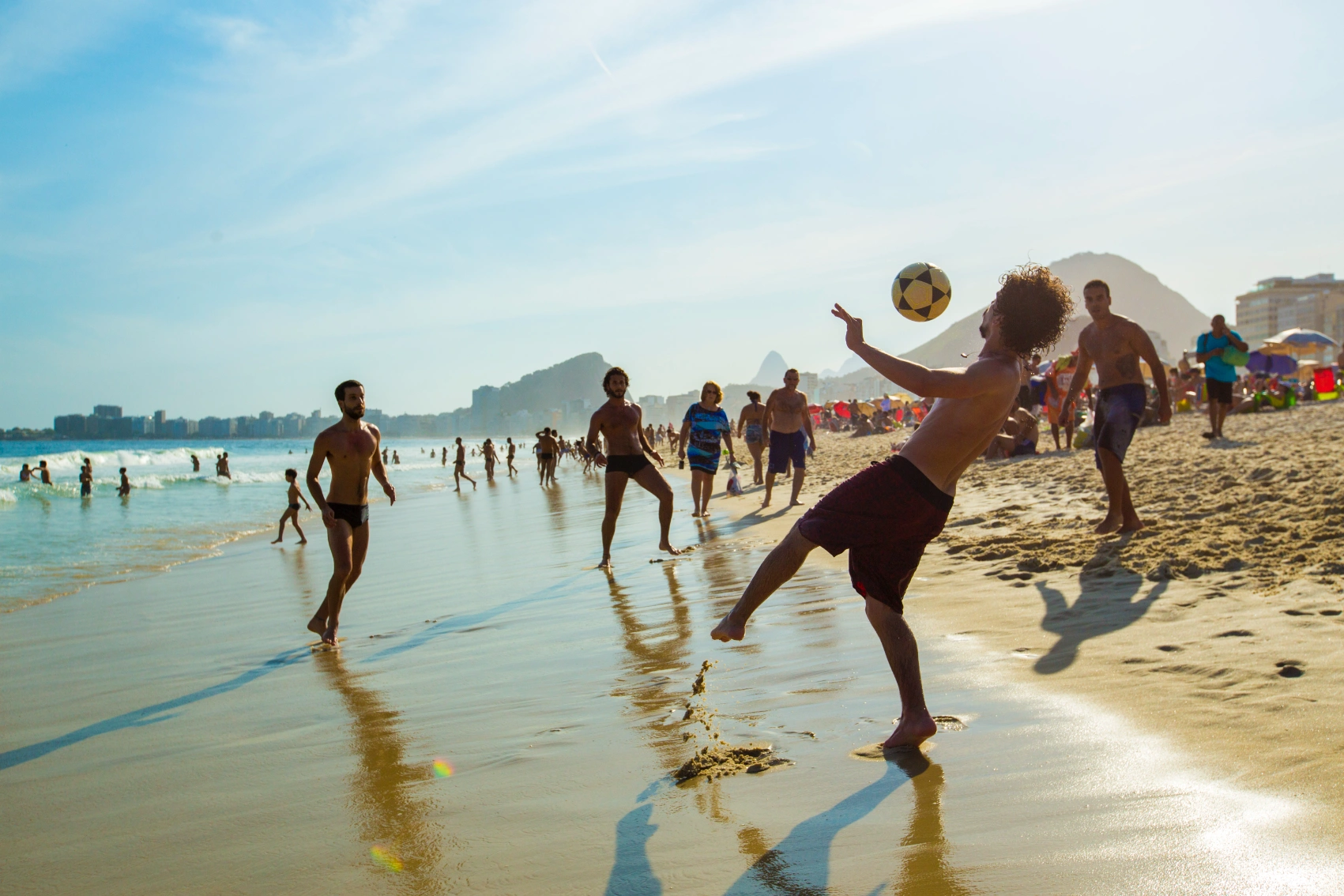 A group of men play soccer on Ipanema Beach in Ri de Janeiro