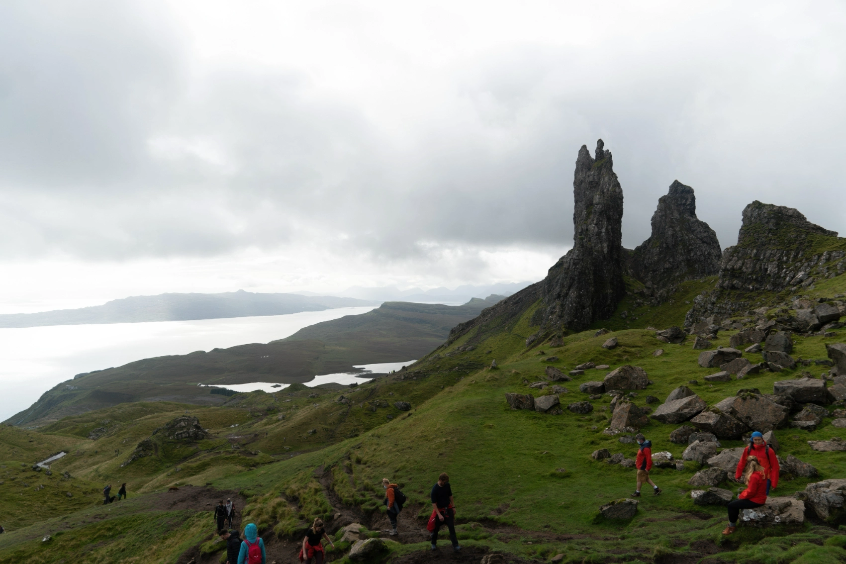 A group of travellers hikes on the Isle of Skye, Scotland