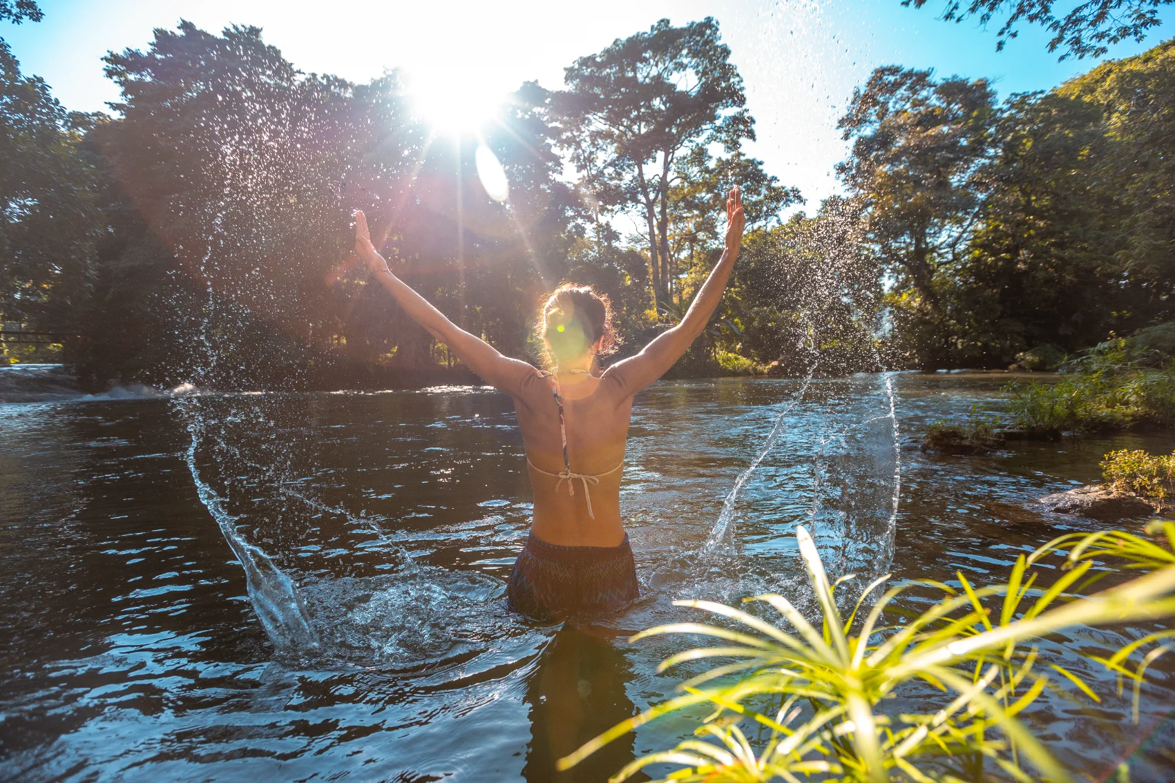 A woman traveller swims in Lago de Yojoa, Honduras