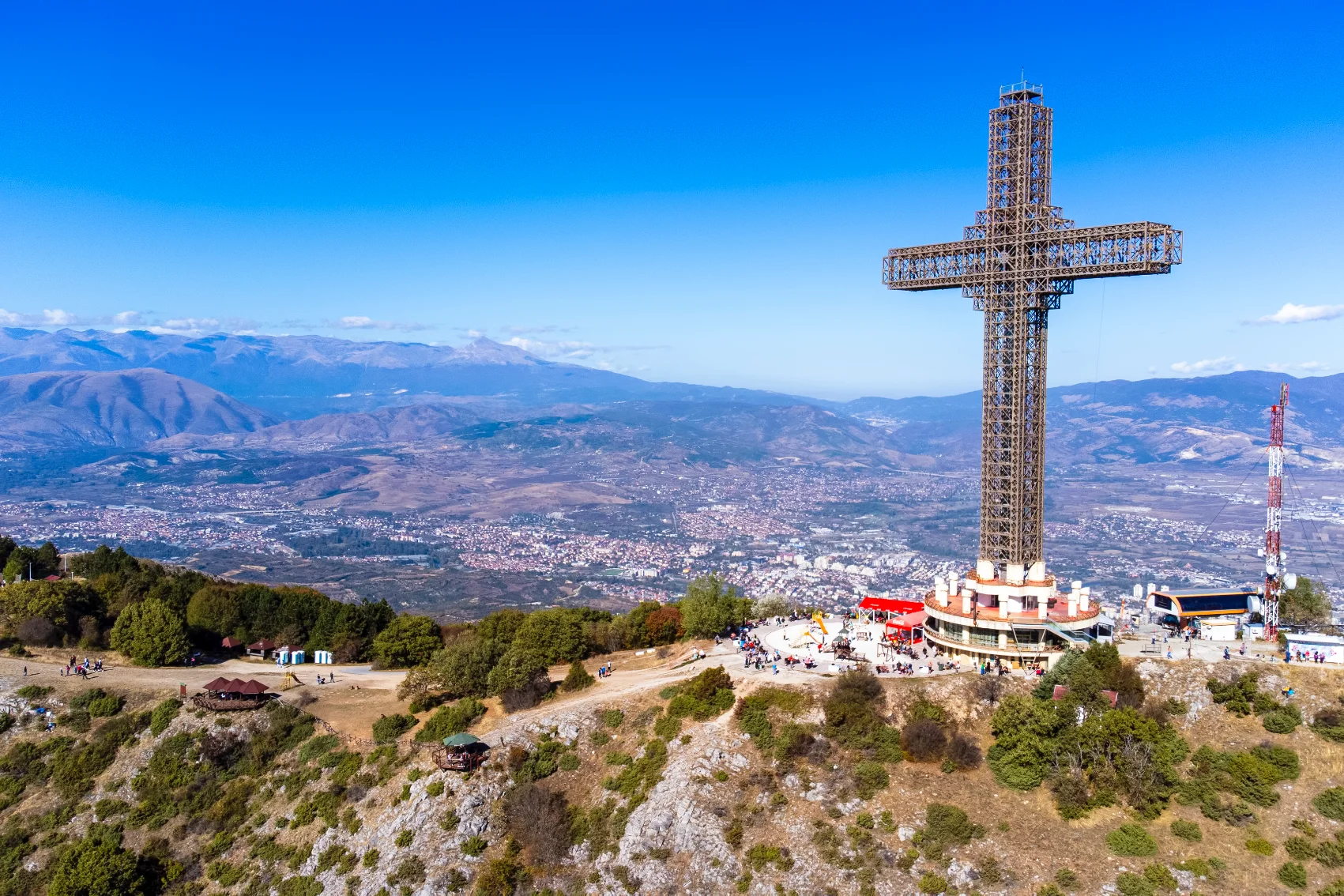Aerial view of the Millennium Cross at the top of a mountain overlooking Skopje, North Macedonia