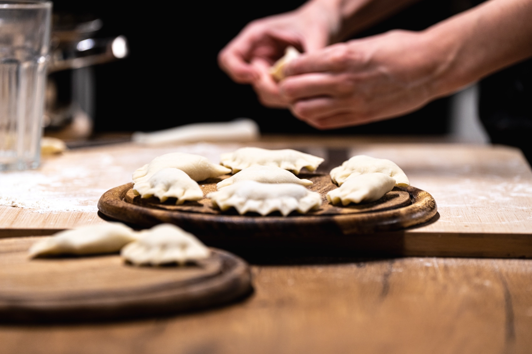 A person making pierogi