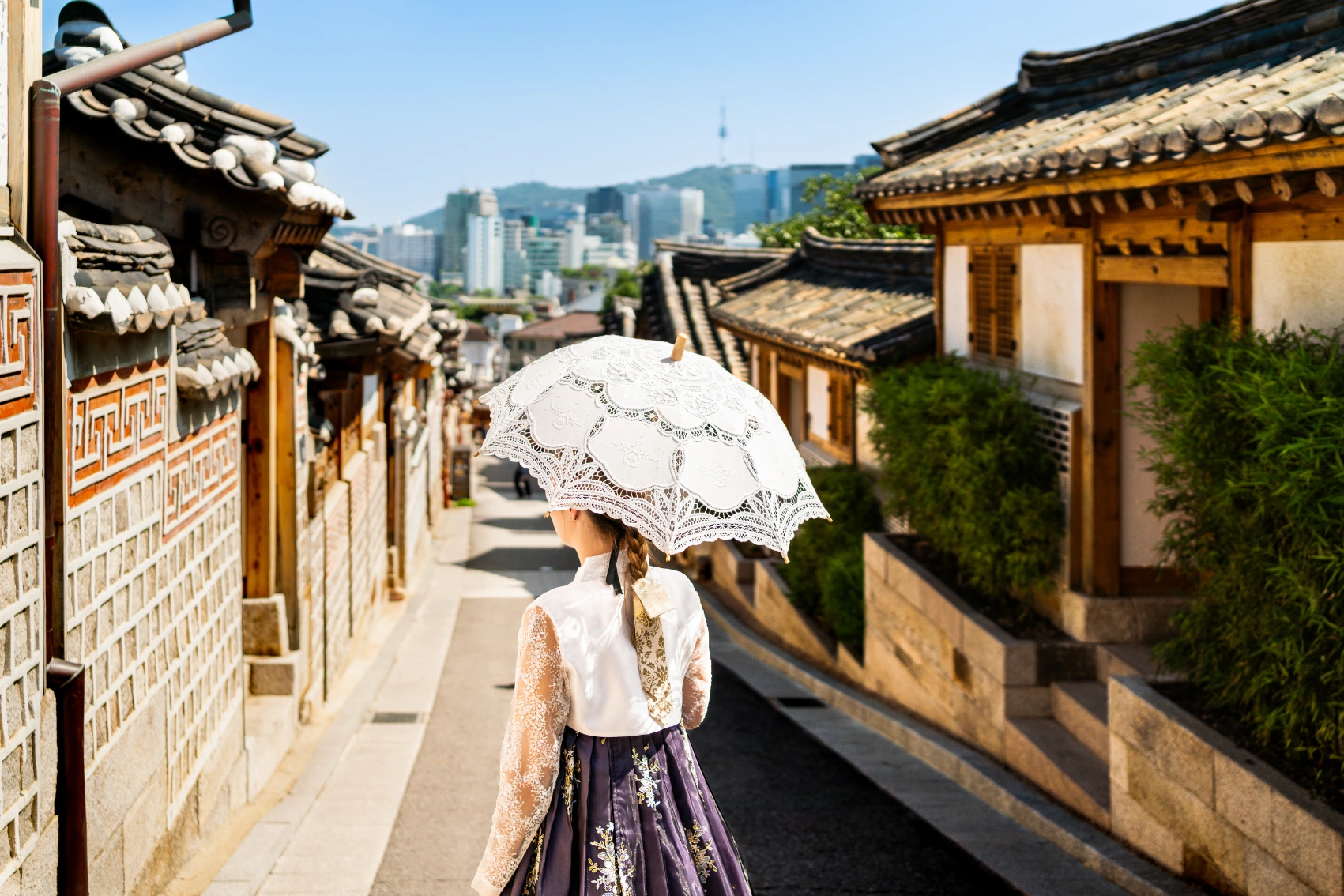 A woman in traditional hanbok dress in Bukchon Hanok Village in Seoul, South Korea