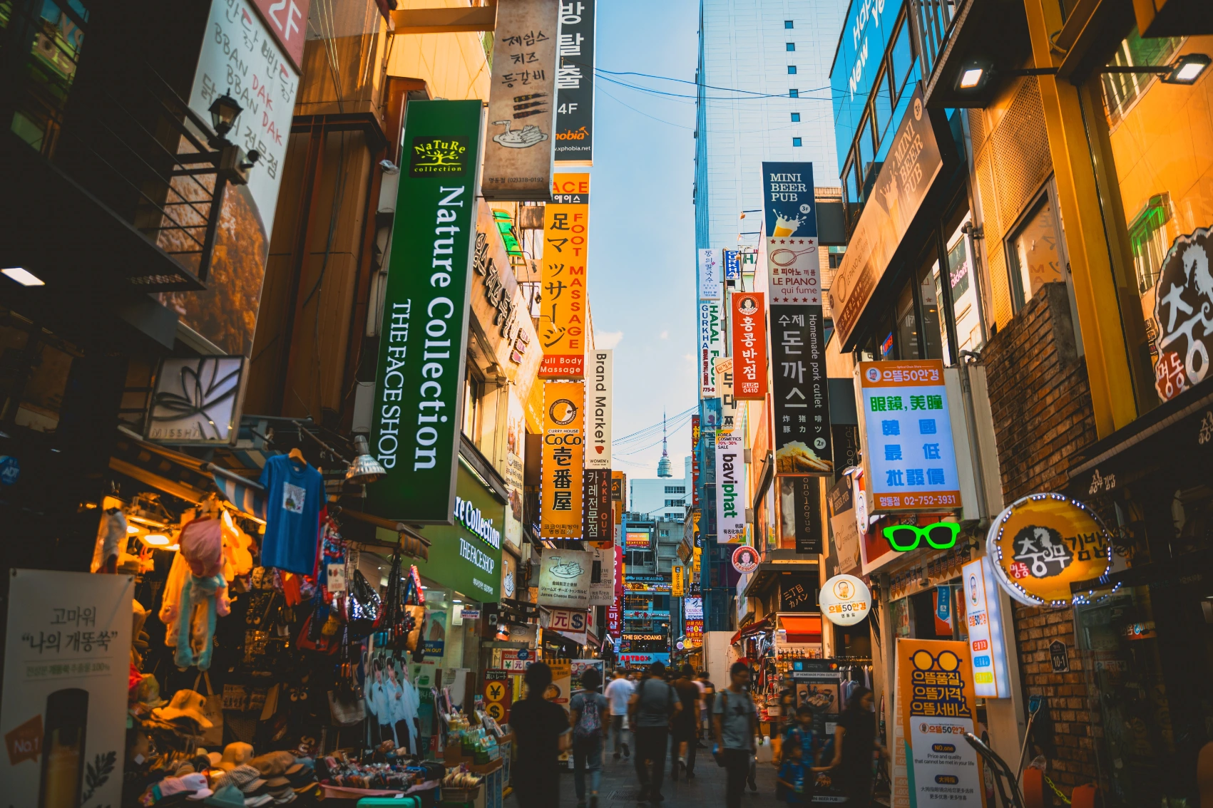 Crowds of people walking and shopping in the Myeondong district of Seoul, South Korea