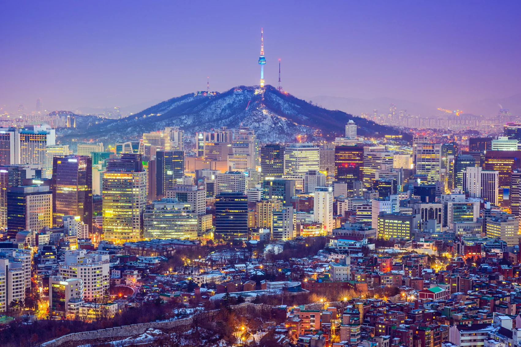 Cityscape of Seoul at night with the N Seoul Tower in the background