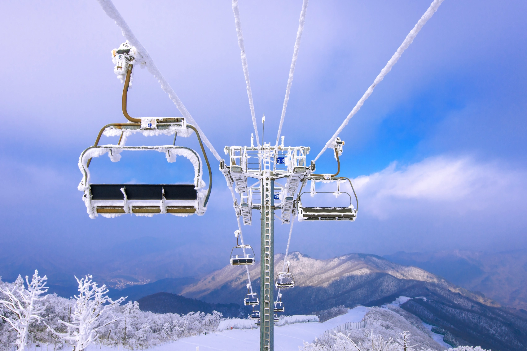 A ski chair lift is covered by snow in winter in South Korea