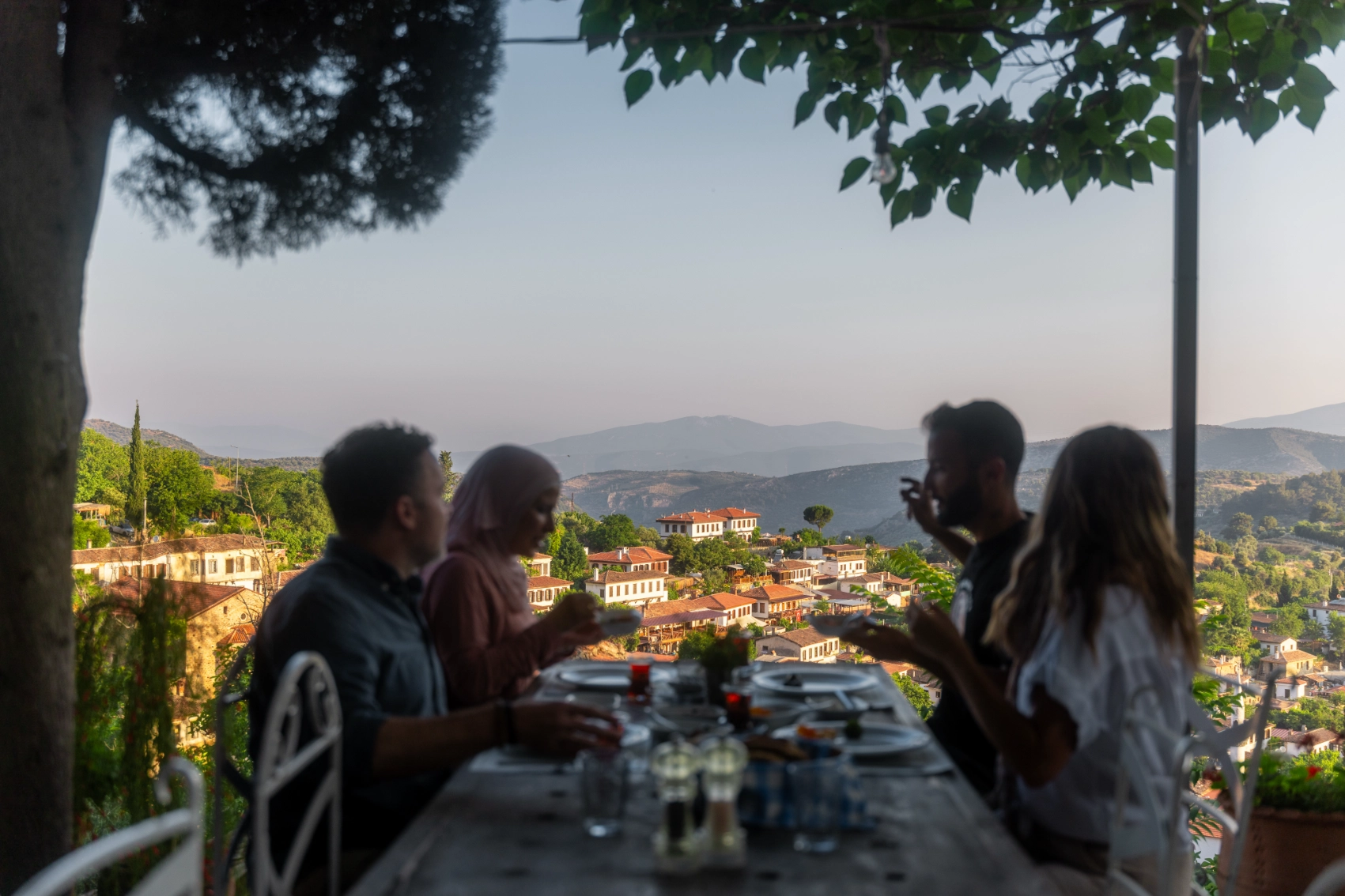 A group of travellers enjoys a meal at a family-run restaurant in Turkey
