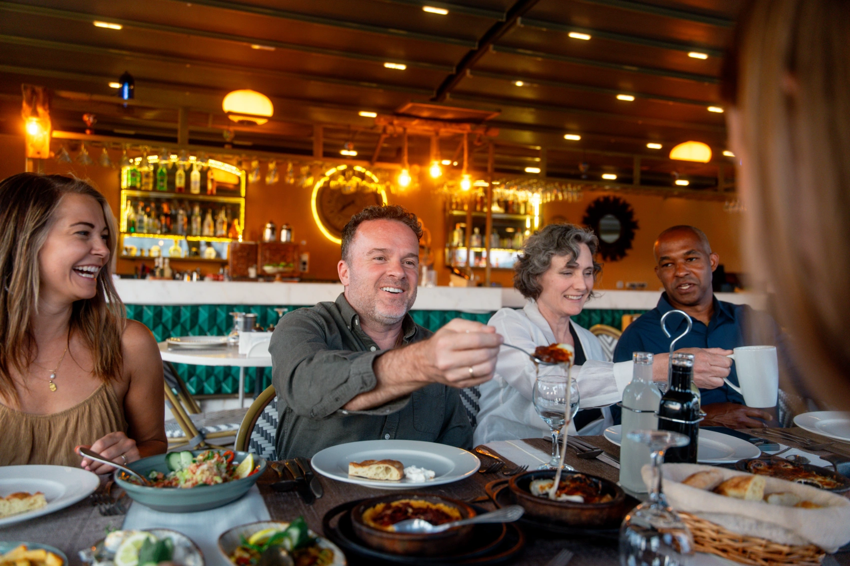 A group of travellers eats at a restaurant in Turkey