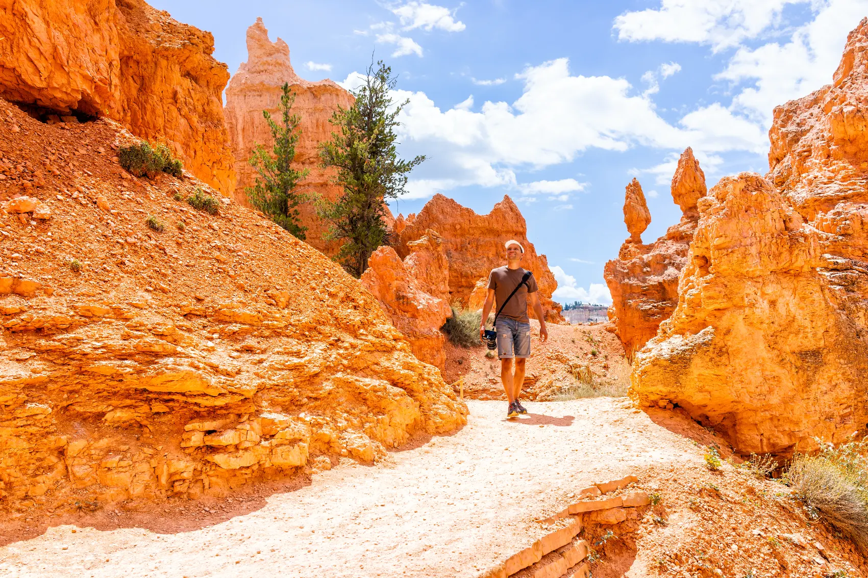 Bryce Canyon National Park, Utah A male hiker walks among orange-coloured hoodoos in Bryce Canyon National Park in Utah