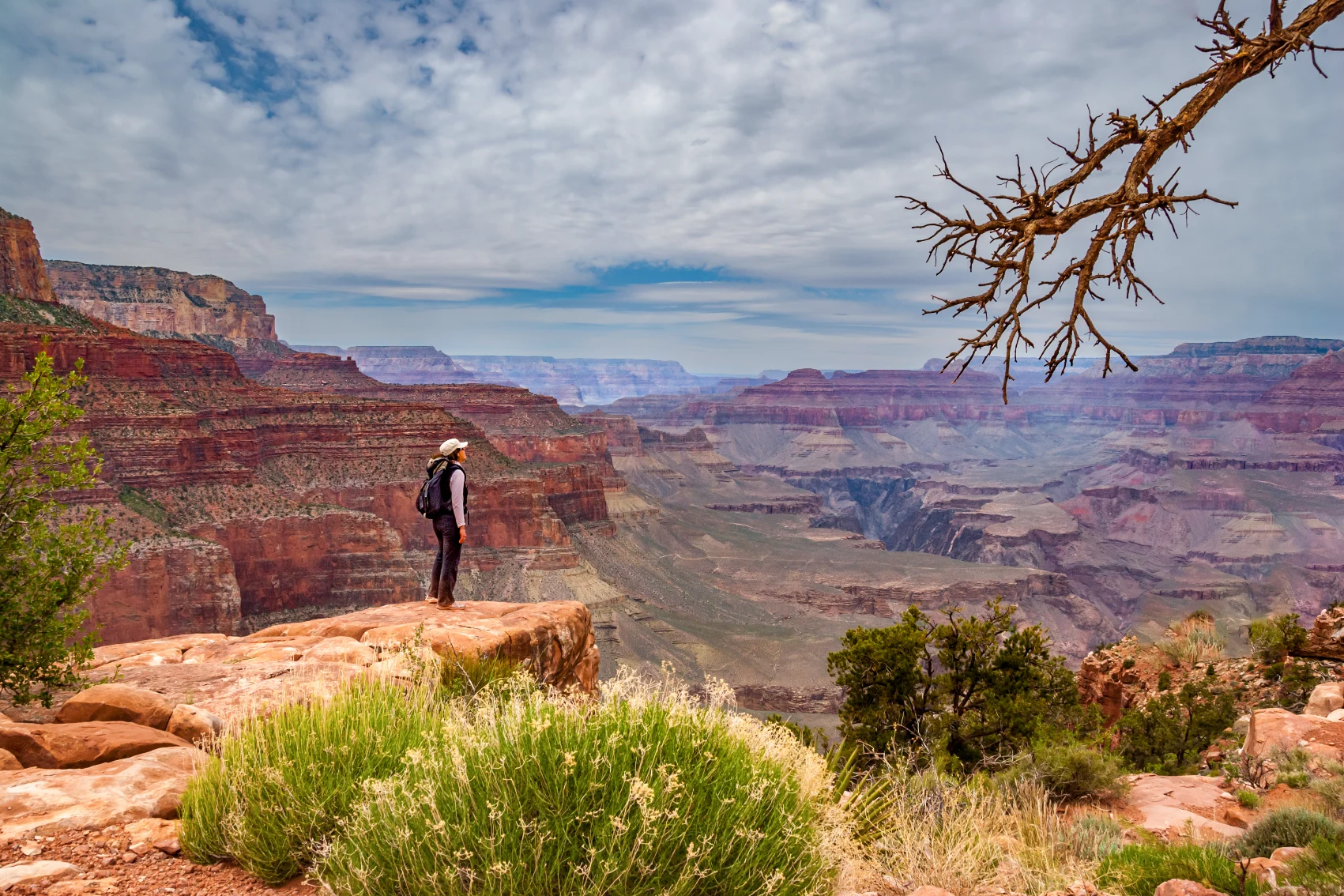 Grand Canyon National Park, Arizona A hiker looks out at the Grand Canyon in Arizona
