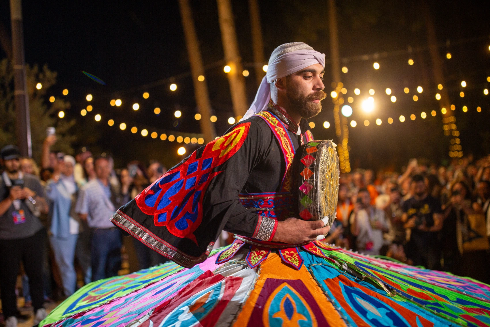 GX Jordan 2025 A man in a traditional tanoura outfit dances at a GX event in Jordan