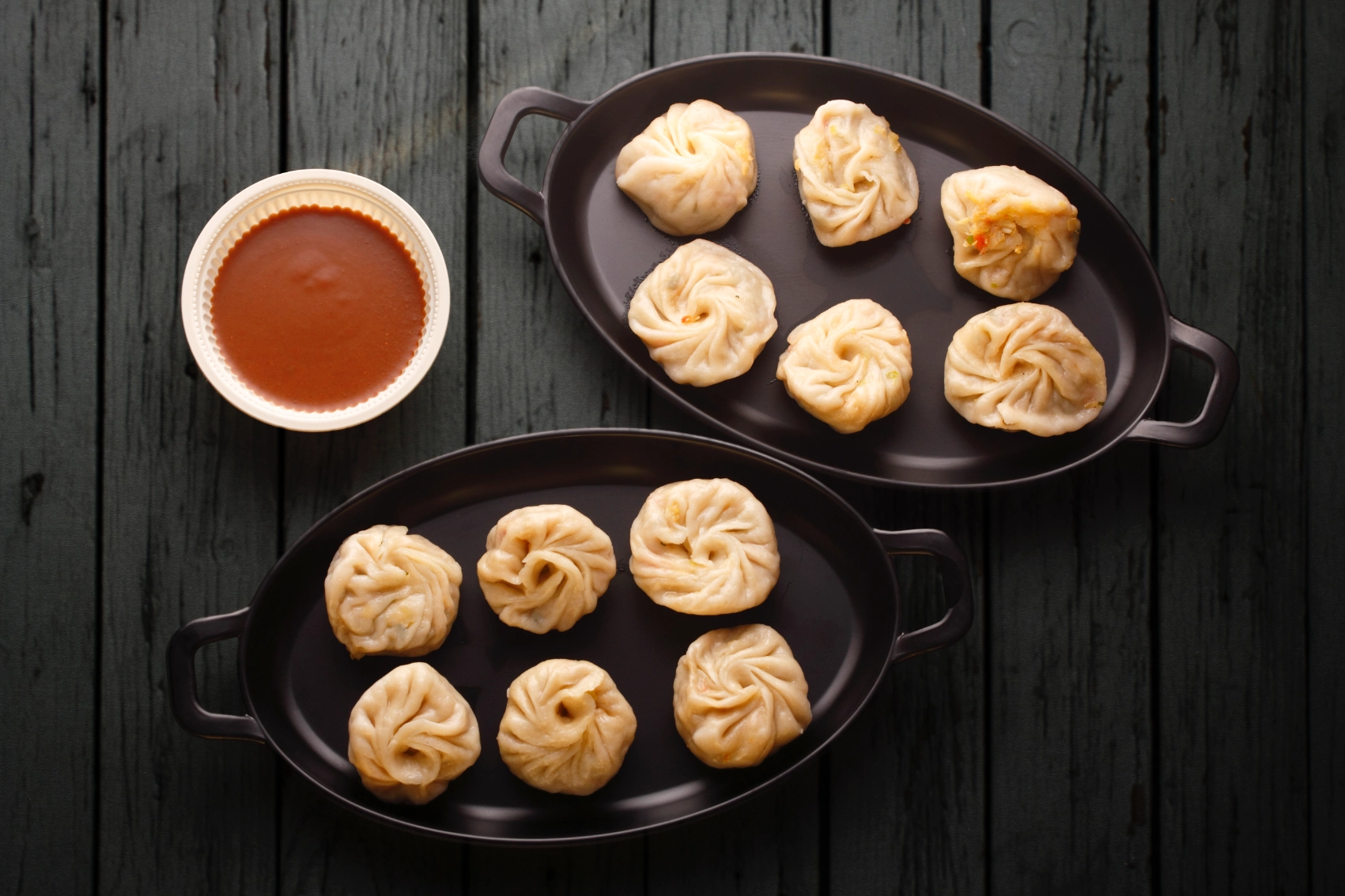 Plates of momos sit on a table in Lhasa, Tibet