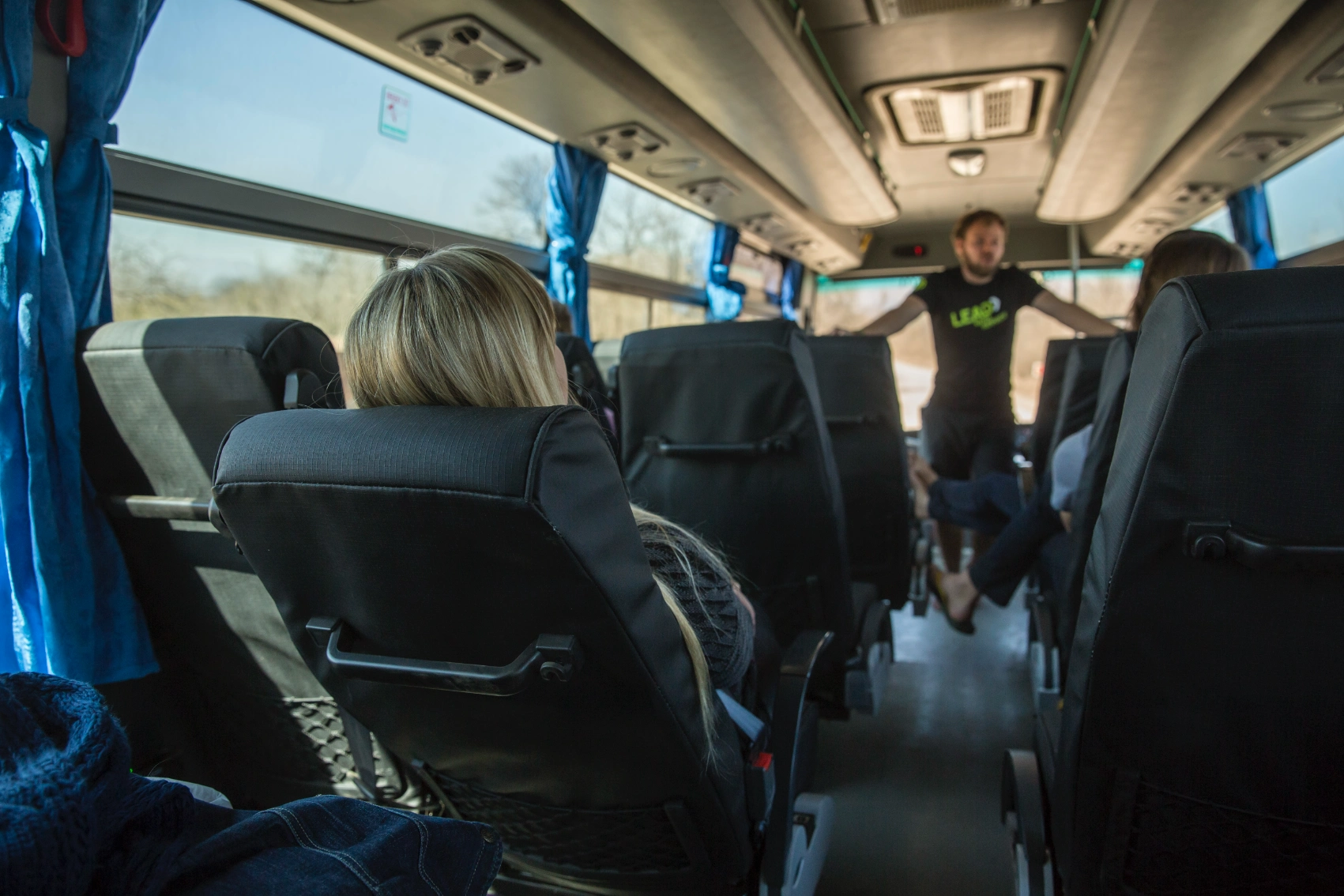 A tour leader speaks to a group of travellers on a G Adventures Lando overland trip in Africa