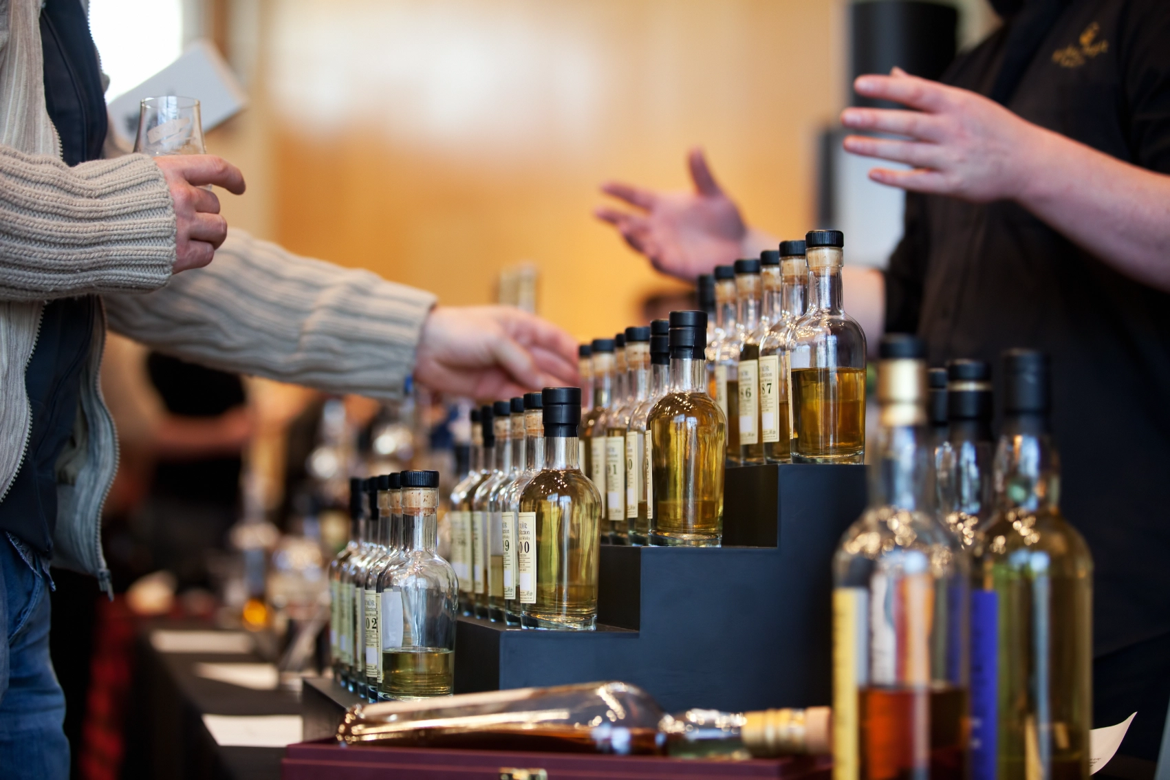 Whisky tasting, Scotland A traveller looks at bottles of whisky in Scotland