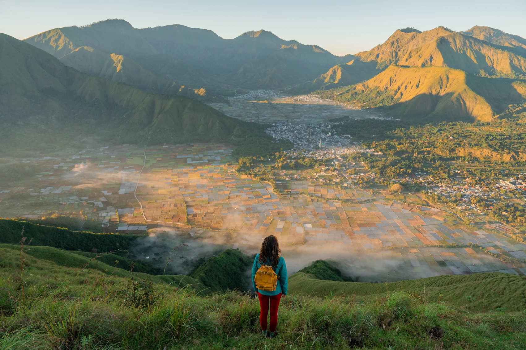 Solo travel in Lombok A woman traveller hikes near Mt Rinjani, Indonesia