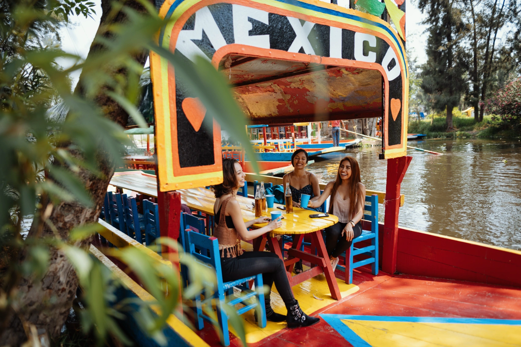 Meeting people in Mexico A group of travelling friends enjoys a beer in Mexico
