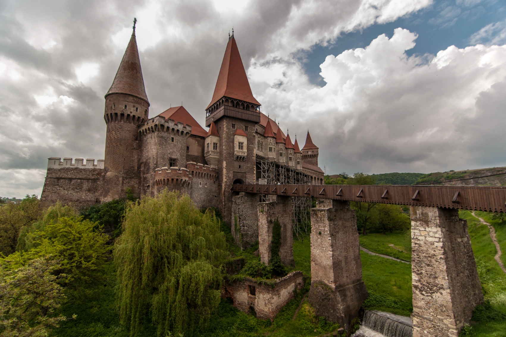 A bridge leads to Corvin Castle in Transylvania, Romania