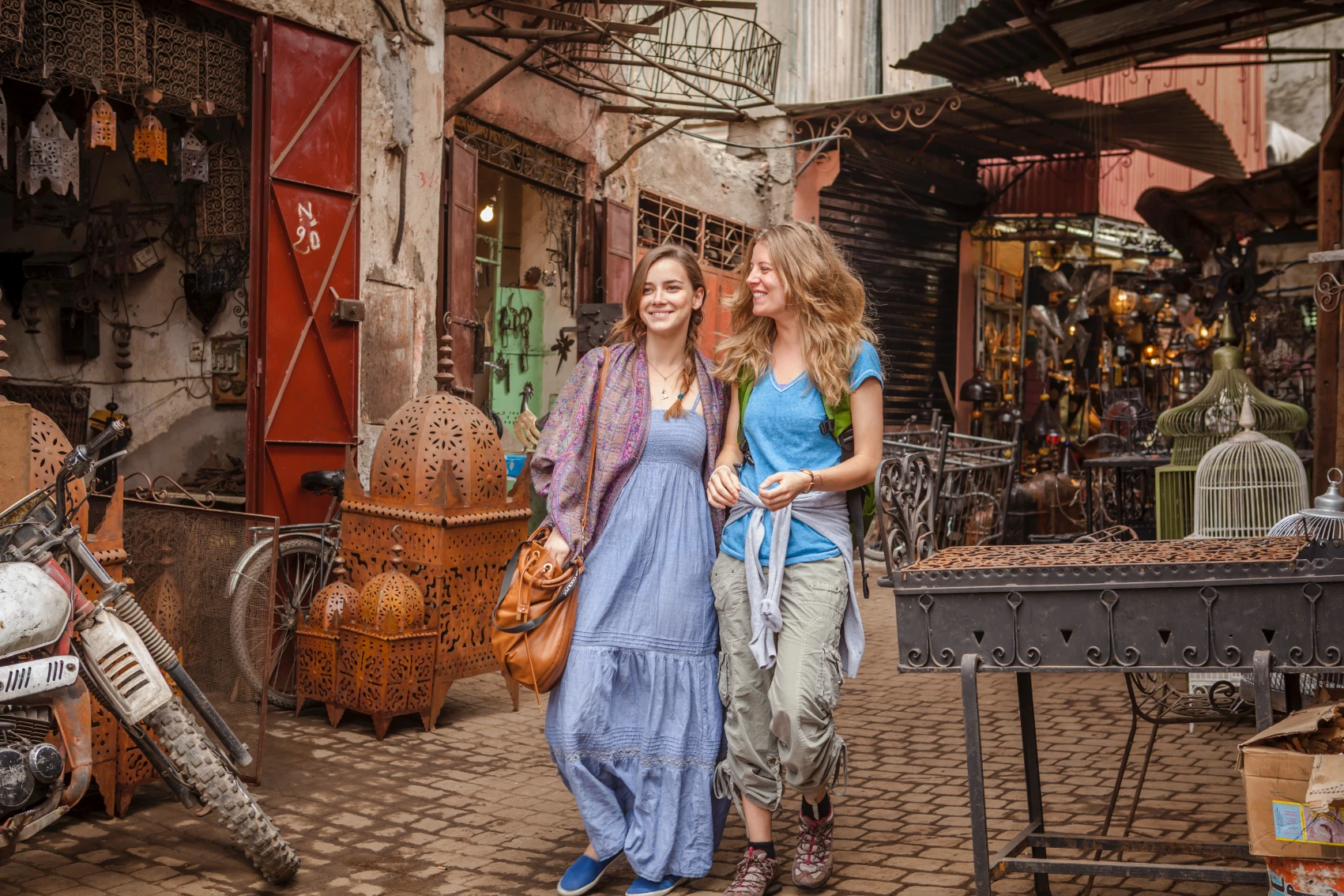 Two women travellers walk through a medina in Morocco