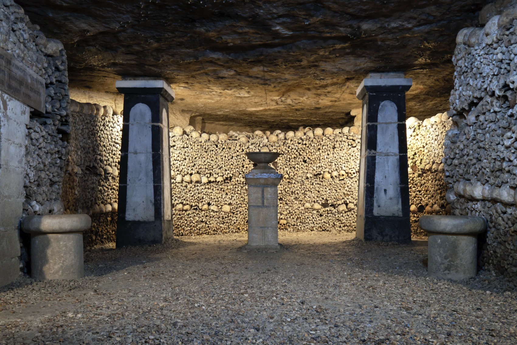 Catacombs of Paris, France Stacked walls of skulls and bones in the Catacombs of Paris, France