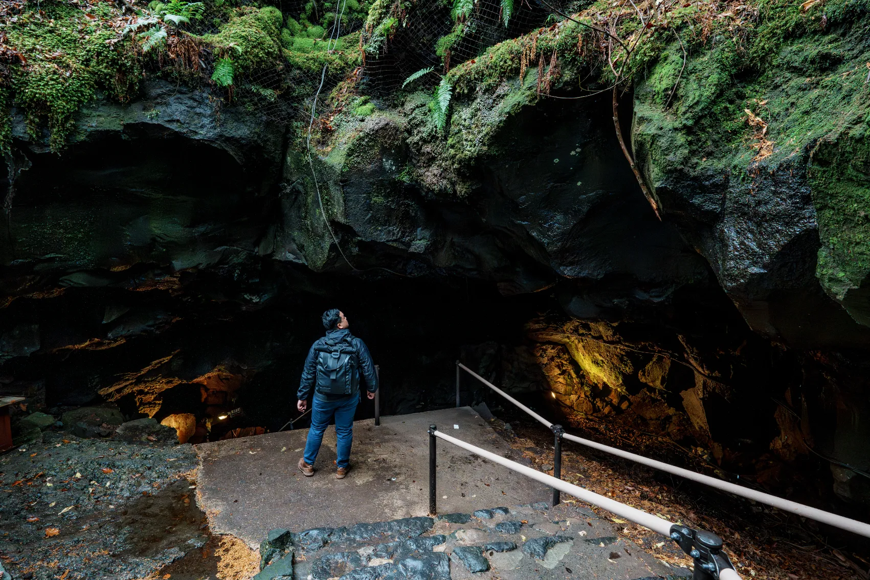 Fugaku Fuketsu Ice Cave, Japan A man stands in front of the entrance to Fugaku Fuketsu Ice Cave in Japan