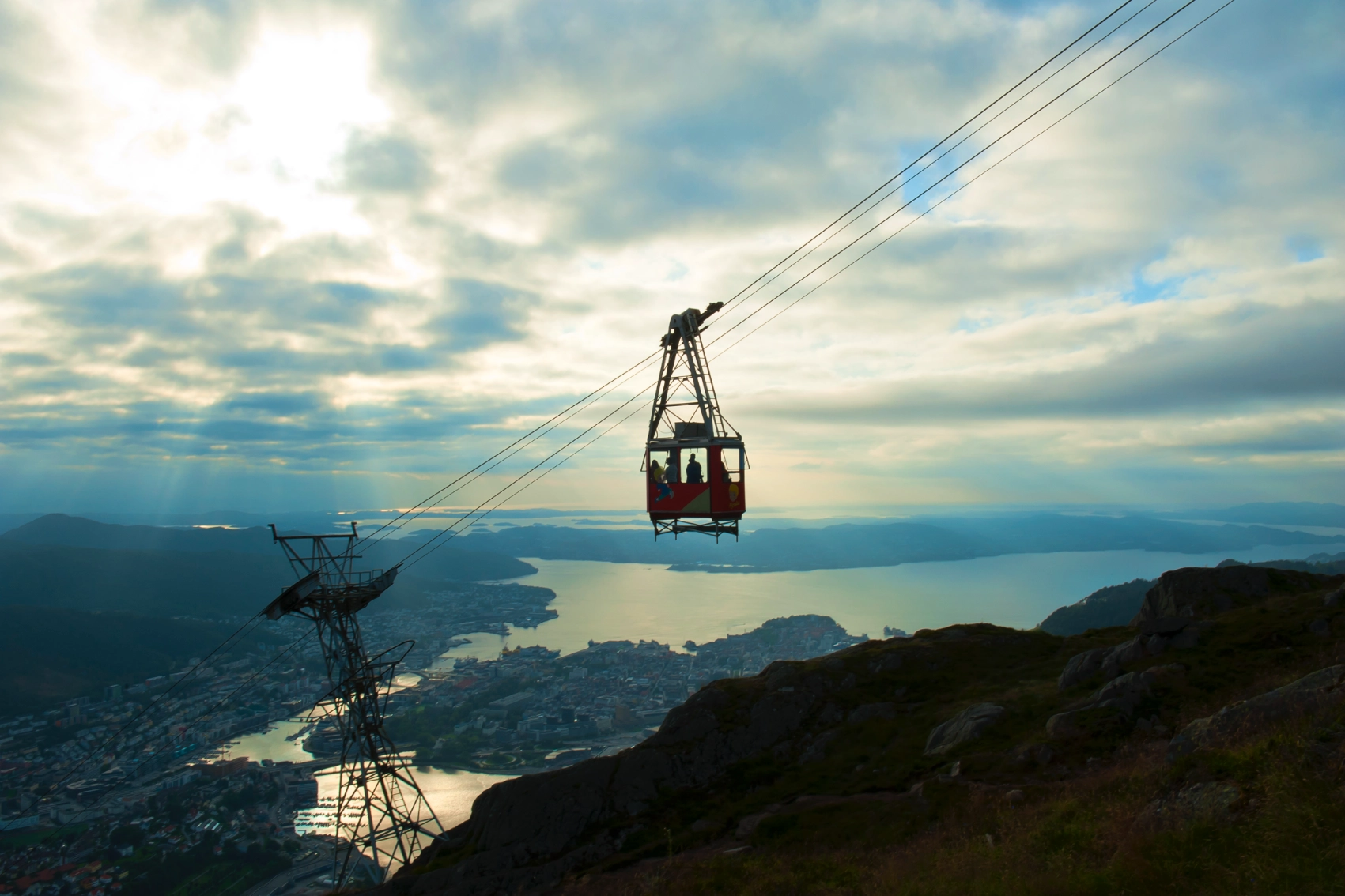 Silhouette of the Ulriken Cable Car travelling down the mountain in Bergen, Norway